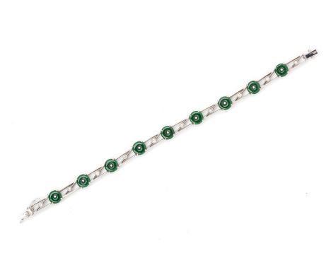 A JADE AND DIAMOND BRACELET
In 18k white gold, of openwork design with green jade disks and round brilliant cut diamonds 
Ind