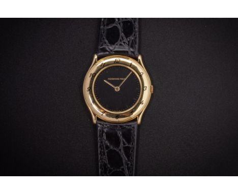 AN AUDEMARS PIGUET LADIES GOLD WATCH
The 18k gold case with black enamel Arabic numeral bezel, the black dial with baton hour