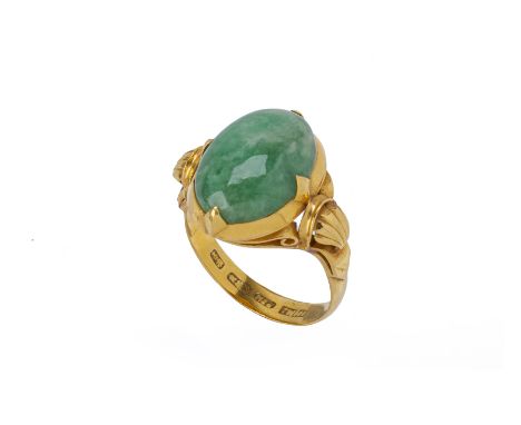 A JADE CABOCHON RING
In 22k yellow gold, the shoulders with shell motifs
Marked 'K22' and with Chinese character marks
US 8.5