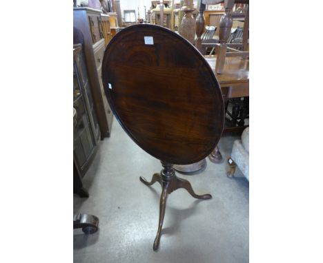A George III style oak circular tilt-top birdcage action tripod table