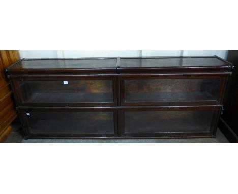 An early 20th Century Globe Wernicke mahogany two tier sectional stacking bookcase
