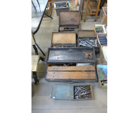 Seven toolboxes, all containing vintage tools