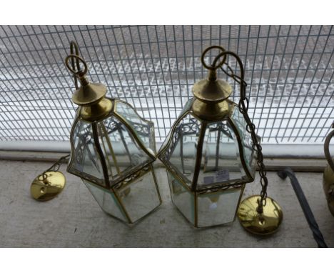 A pair of gilt metal lantern style ceiling lights