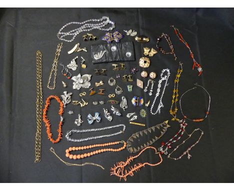 A selection of costume jewelleryTo include Trifari, Monet, and coral beads etc. 