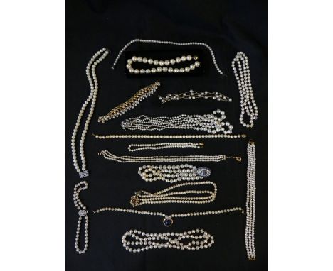 A selection of imitation pearl jewelleryTo include a Trifari necklace, strands, etc. 