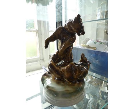 A Zsolnay Pecs model of two fighting bears raised on a plinth base, marked to reverse 'Markap Bela', height 30cm 