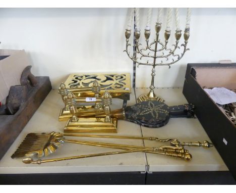 A mixed lot of brasswares comprising fire tools, trivet, Menorah candlestick, fire dogs, plus further bellows with studded de