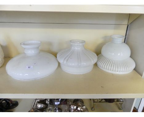 Four opaque vesta style glass light shades of slightly varying designs 