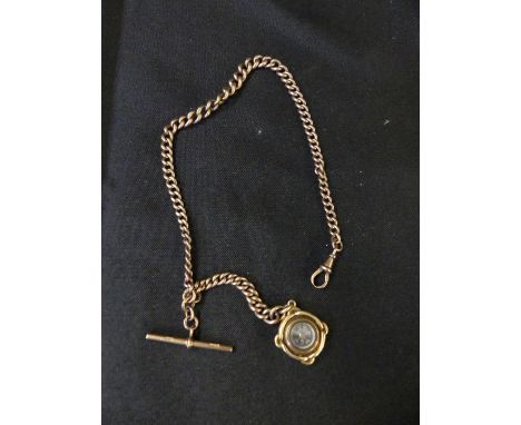 An early 20th century 9ct gold Albert chainThe graduated flat curb link chain with spring clasp, suspending a compass fob, to