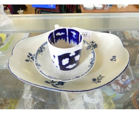 An Antique Worcester oval dish with frilled rim, painted with flowers, blue crescent mark to reverse, together with a further