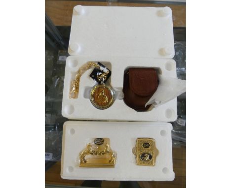 A Colt Collectors Choice pocket watch, the watch face opens to reveal an army peacemaker, further Colt lighter and stand, com
