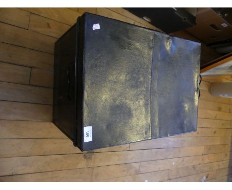 A vintage black painted metal trunk 