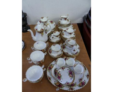 A collection of Royal Albert old Country Rose tea, table and coffee wares to include coffee pot, tea cups, saucers, dinner pl