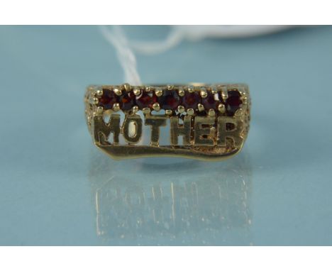 A 9ct gold ring depicting the word 'Mother' with a row of claw set garnets above, size S, weight approx 5.5g