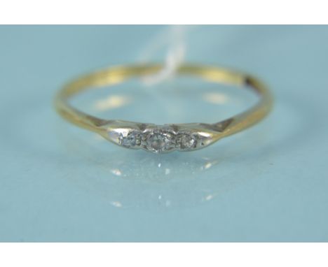 An 18ct platinum set three stone diamond ring, size K 1/2, weight approx 1.4g