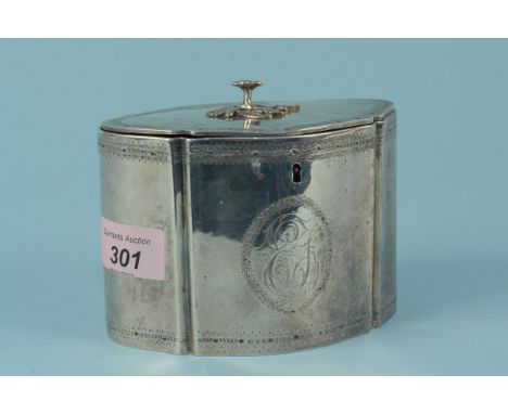 A Georgian silver tea caddy with engraved border and large monogram to centre with applied floral knop, hallmarked London 178