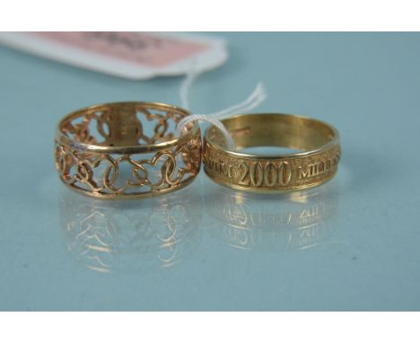 A 9ct gold band ring engraved Millennium together with a 9ct gold pierced heart design band ring, weight approx 6.5g 