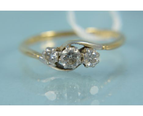 An 18ct platinum set three stone diamond ring, size P, weight approx 2g