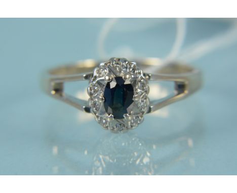An unmarked white metal sapphire and diamond set ring, size S 1/2, weight approx 4g