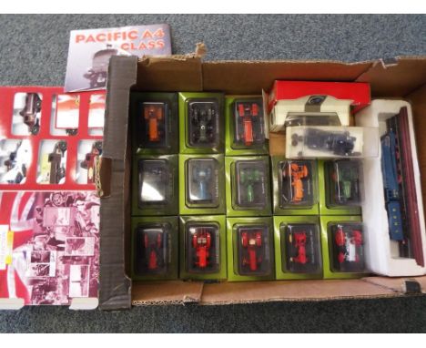 A good lot to include, 13 diecast models of tractors in presentation boxes, a Hornby OO gauge insulated milk van, a Heritage 