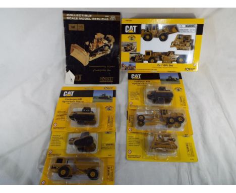 Diecast - A quantity of diecast model motor vehicles by Norscot depicting CAT industrial and agricultural vehicles, all in 1: