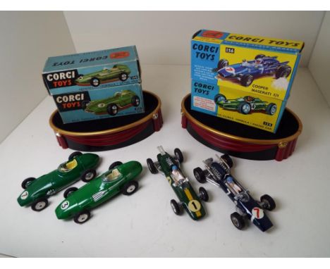 Corgi Toys - four Formula 1 Grand Prix model racing cars comprising Vanwall # 150, BRM # 152, Lotus Climax # 155 and Cooper M