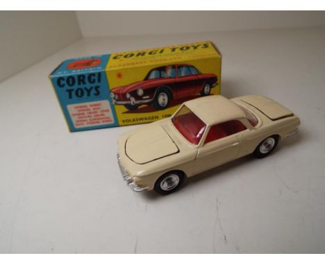 Corgi Toys - Volkswagen 1500 Karmann Ghia # 239, cream body with red interior, spun hubs, mint in original blue and yellow pi