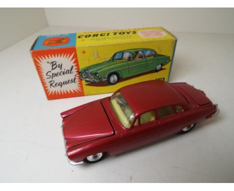 Corgi Toys - Jaguar Mark X, # 238 red body, yellow interior, spun hubs, mint in near mint original picture box with leaflet -