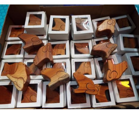 Unused retail stock - A collection of 60 wooden puzzles in the form of frogs with a secret trinket compartment, part boxed.