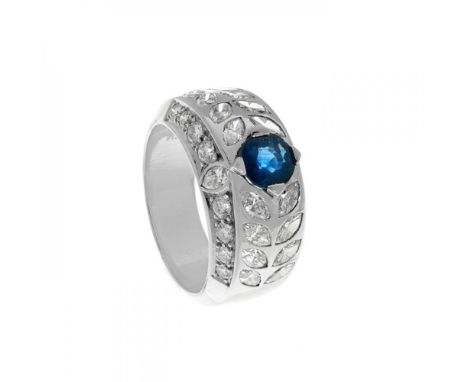 Platinum ring With central sapphire, round size, ca. 1.00 cts and diamonds, color H, purity VS and total weight ca. 2.40 cts.