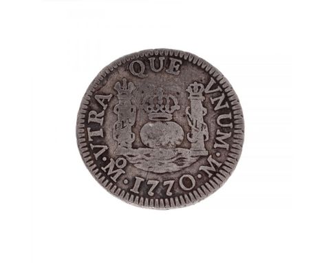 One real coin of Carlos III, mint of Mexico, 1770.Sterling silver.Measurements: 20,36 mm in diameter.Weight: ca. 4,08 grams.S