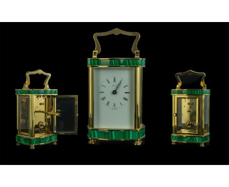 An English Henley Carriage Clock, with a Malacite trim and brass case.  Working at the time of cataloging.