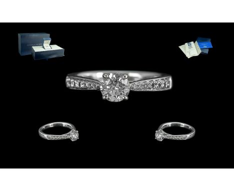 Ladies Superior Quality Platinum Diamond Set Dress Ring. The Central Round Brilliant Cut Diamond of Excellent Colour / Clarit