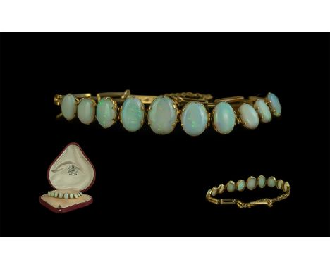 Antique Period 9ct Gold Opal Set Bracelet - The Opals In Graduated Form and Excellent Colour. Nine Opals In Total. Est Weight