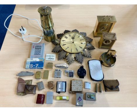 Box of Collectibles, including brass miner's lamp, sunburst wall clock, carriage clocks, Vesta cases, lighters, compact, etc.