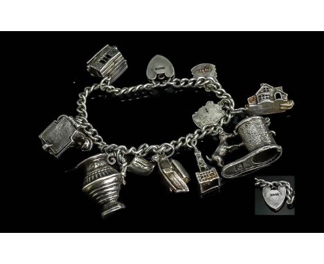 A Good Quality Vintage Sterling Silver Bracelet Loaded with 8 Good Quality Charms. All Marked 925 Silver. Comprises Telephone