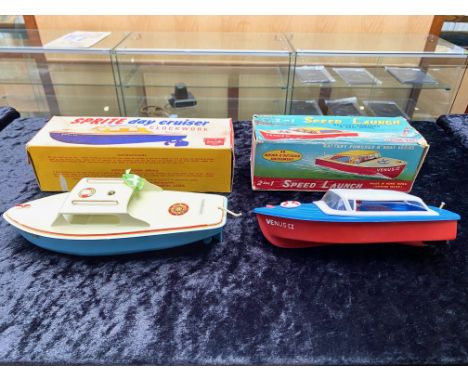 Two Vintage Boxed Speedboats, comprising a Sprite Day Cruiser Clockwork Boat by Sutcliffe, original box, boat appears unused.