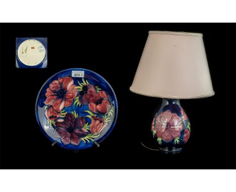 Two Moorcroft Pieces, comprising a Table Lamp &amp; Plate, Hibiscus pattern on a blue ground, plate 10" diameter, lamp Moorcr