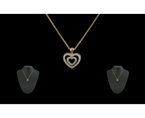 18ct Gold Double Heart Shaped Diamond Set Pendant - Attached to a 18ct Gold Chain. Both Pieces Marked 18ct. The Round Faceted