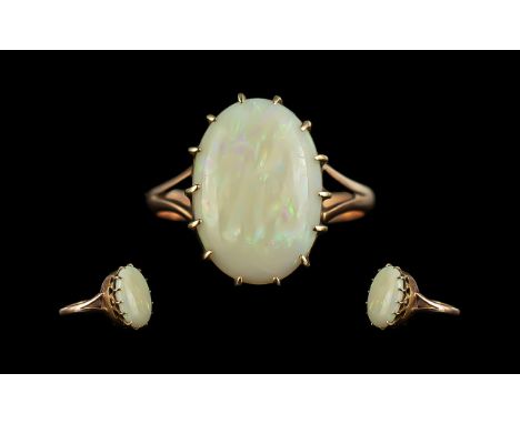 Ladies 9ct Gold Attractive Single Stone Opal Set Ring. The Large Oval Shaped Opal of Good Colours. Ring Size N. Weight 2,5 gr