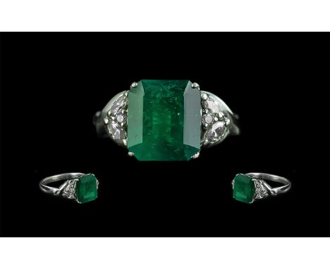 Platinum Superb Emerald and Diamond Set Dress Ring, marked platinum 900 to shank, the square shaped, star cut emerald of exce