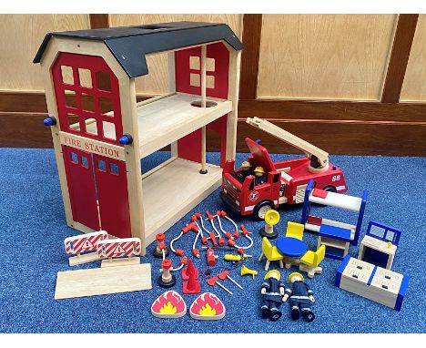 Child's Wooden Fire Station, measures 22" high x 23" wide, with a box of wooden fire equipment, firemen, station equipment, h