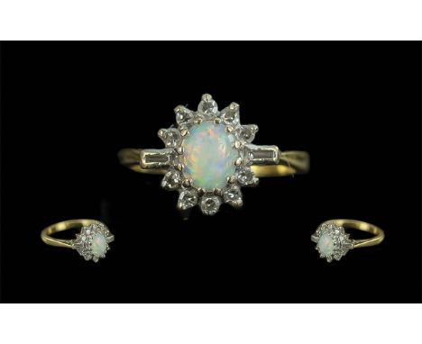 Ladies 18ct Gold Attractive Diamond and Opal Set Ring. Flower head Design. Marked 18ct to Interior of Shank. The Central Opal