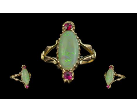 Antique Period Attractive 9ct Gold Opal and Ruby Set Ring, Not Marked but Tests Gold. The Central Opal of Excellent Proportio