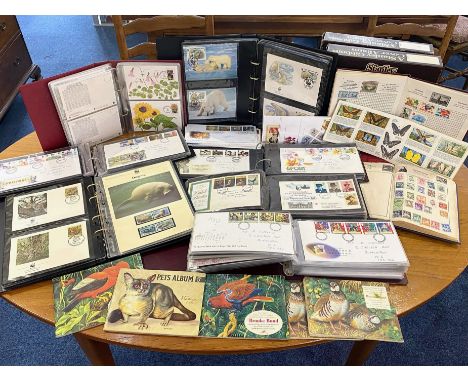 Large Box of First Day Covers, in albums, collection of stamps in albums, sets of Brooke Bond tea cards in albums, two folder