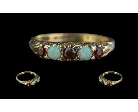 Ladies Attractive 9ct Gold Opal and Garnet Set Ring - Full Hallmark To Shank. Ring Size (K) Small Size. Weight 2.3 grams. Sha