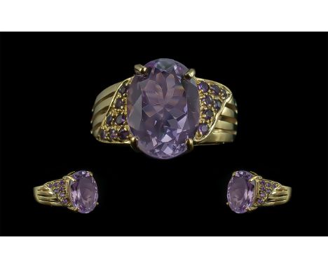 Ladies Attractive 9ct Gold Amethyst Set Dress Ring - Full Hallmark to Shank. The Central Large Oval Shaped Amethyst of Good C