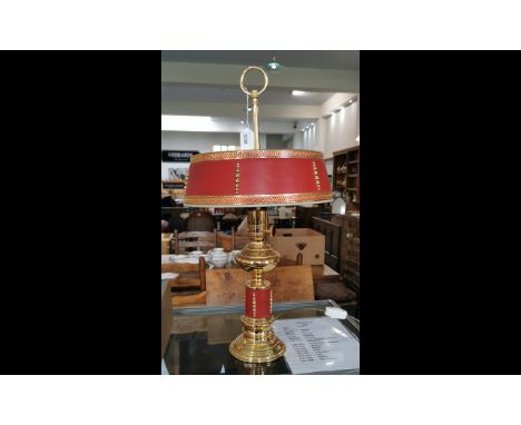 Brass Table Lamp, with red and gilt trim to base and matchine red and gilt shade.  Lit with twin bulbs.  Measures 27" high.