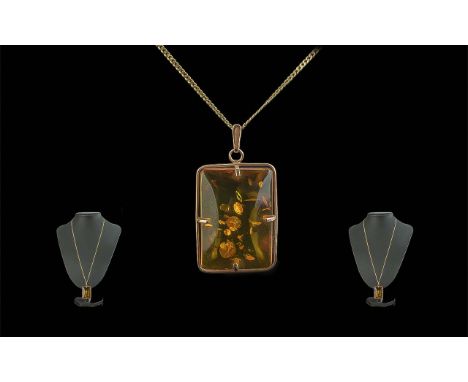 A Ladies 14ct Gold Attractive Amber Set Pendant of Rectangular Form with Attached 9ct Gold Long Chain. Weight 11 grams. Penda
