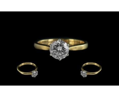 Ladies 18ct Yellow Gold and Platinum Single Stone Diamond Set Ring. The Round Modern Brilliant Cut Diamond of Excellent Cut /